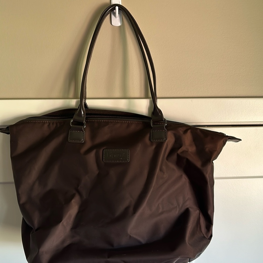 Lipault Paris nylon tote with sleeve and top zipper.